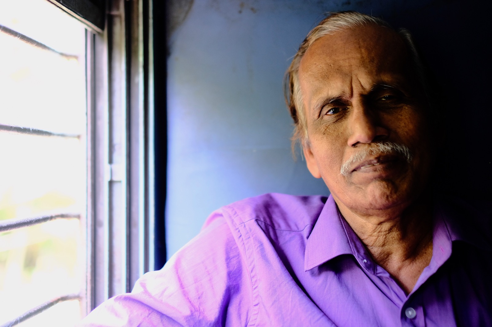 Man On the Train from Alleppey to Kochi